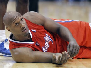 FILE- This March 26, 2013, file photo, shows Los Angeles Clippers' Lamar Odom during an NBA basketball game in Dallas. Odom was arrested for allegedly driving under the influence early Friday, Aug. 30, 2013, after a CHP officer saw his white Mercedes-Benz traveling erratically on a San Fernando Valley freeway. The CHP says Odom, 33, was arrested after failing a field sobriety test. (AP Photo/Brandon Wade, File)