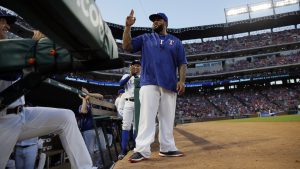 Retired Texas Rangers player Prince Fielder acknowledges fans after being introduced in the first inning of a baseball game against the Oakland Athletics, Saturday, Sept. 17, 2016, in Arlington, Texas. (AP Photo/Tony Gutierrez)