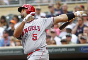 Los Angeles Angels' Albert Pujols watches his two-run home run off  Minnesota Twins pitcher Kyle Gibson during the first inning of their baseball game, Sunday, April 17, 2016 in Minneapolis. (AP Photo/Andy Clayton-King)