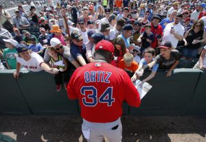 Boston Red Sox's David Ortiz (34) signs autographs for fans before a spring training baseball game against the Minnesota Twins on Thursday, March 31, 2016, in Fort Myers, Fla. (AP Photo/Tony Gutierrez)