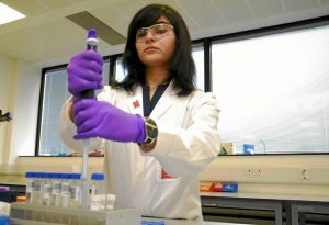 In a handout picture obtained from the London Organising Committee of the Olympic and Paralympic Games (LOCOG) received on January 19, 2012 British analyst Arian Nemani demonstrates how the handle samples in the newly unveiled anti-doping laboratory which will test athletes' samples from the London 2012 Olympic Games in Harlow, Essex on January 19, 2012. British Sports Minister Hugh Robertson warned drug cheats there would be no hiding place at the Olympics as the London games anti-doping centre was unveiled. AFP PHOTO / LONDON 2012 RESTRICTED TO EDITORIAL USE - MANDATORY CREDIT " AFP PHOTO / LONDON 2012 " - NO MARKETING NO ADVERTISING CAMPAIGNS - DISTRIBUTED AS A SERVICE TO CLIENTS