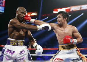 Manny Pacquiao, right, of the Philippines, hits Timothy Bradley during their WBO welterweight title boxing bout Saturday, April 9, 2016, in Las Vegas. (AP Photo/Isaac Brekken)