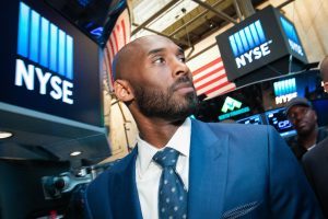 In this Monday, Aug. 22, 2016, photo provided by the New York Stock Exchange, retired NBA star Kobe Bryant visits the exchange, in New York. Bryant has partnered with Jeff Stibel, an entrepreneur and investor, to form the $100 million venture-capital firm Bryant Stibel, based in Los Angeles. (New York Stock Exchange via AP)