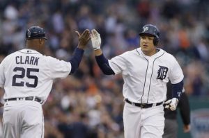 Detroit Tigers' Miguel Cabrera, right, is congratulated by third base coach Dave Clark after his two-run home run off Tampa Bay Rays pitcher Matt Andriese during the third inning of a baseball game, Friday, May 20, 2016, in Detroit. (AP Photo/Carlos Osorio)